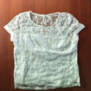 Hollister lace t-shirt with pocket. Size medium.